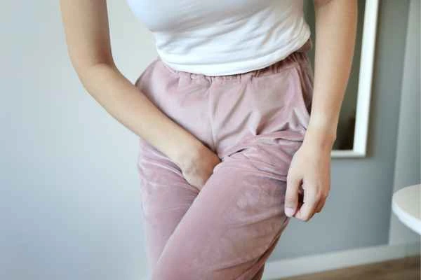 woman struggling with urine incontinence St Helens